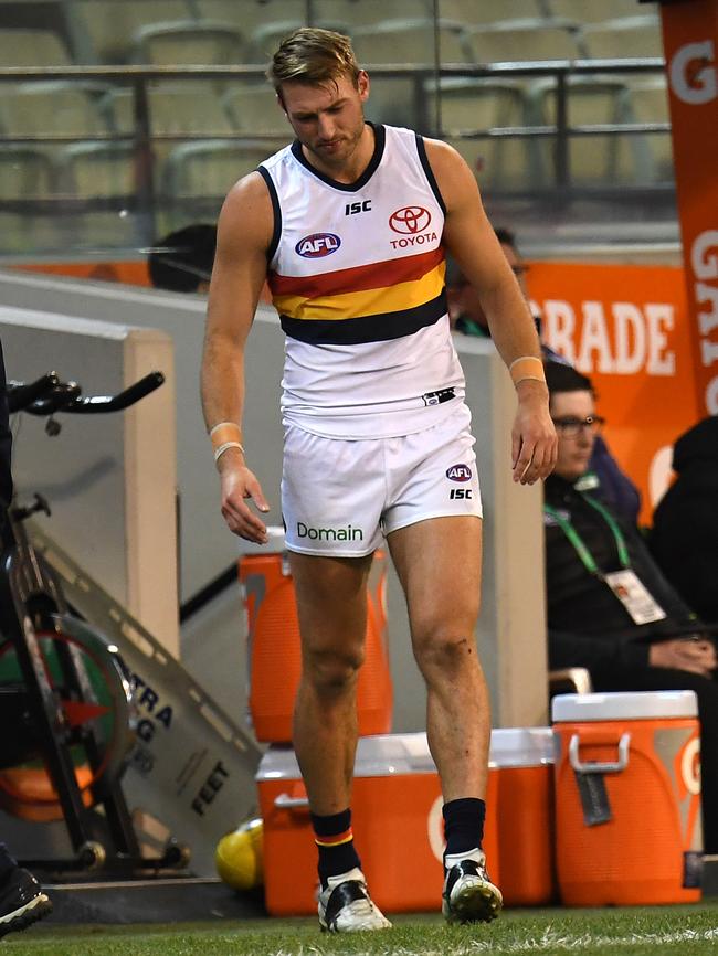 Daniel Talia in pain on the sidelines after injuring his foot. Picture: AAP Image/Julian Smith