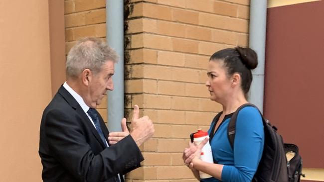 Hannah Phelan speaks to defence solicitor Steven Bolt outside Lismore Local Court.