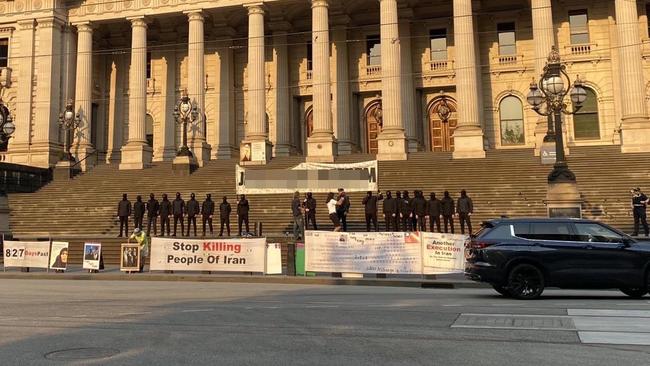 Neo-Nazis hold an anti-semitic sign on Spring St. Picture: Supplied