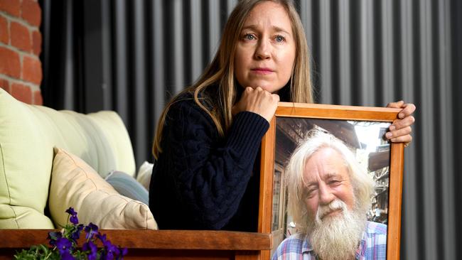 SA WEEKEND: CUDLEE CREEK FIRE. Jasmine Berry with a portrait of her father Ron Selth who died as a result of the Cudlee Creek fire. Picture: Tricia Watkinson