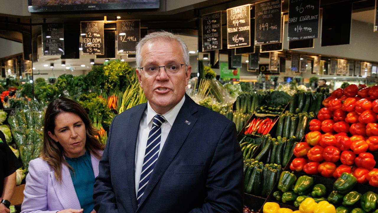 Scott Morrison with Dunkley candidate and former Survivor contestant Sharn Coombs at Palamara Village Fruits. Picture: Jason Edwards