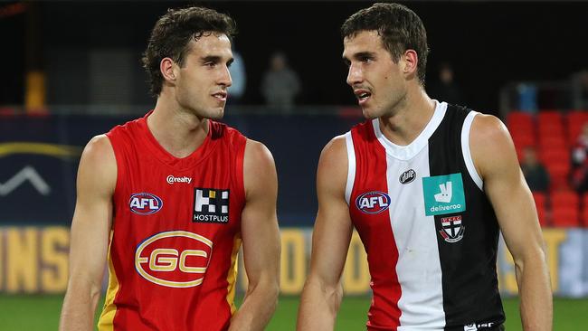 Twin brother Ben King of the Suns, left, and Max King of the Saints after the game. Picture: Michael Klein