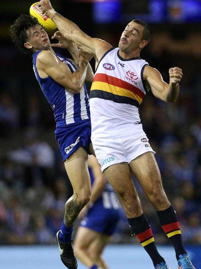 Taylor Walker attempts to spoil Jasper Pittard on Saturday. Picture: AAP Image/Hamish Blair