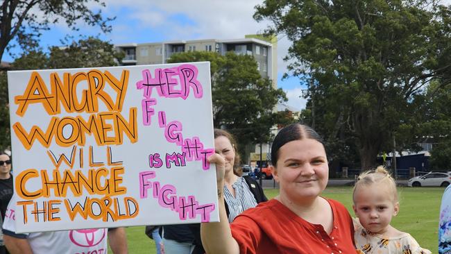 More than 100 people marched in the No More Violence Rally in Toowoomba's Queens Park, organised by volunteer group What Were You Wearing to advocate for more funding to stop domestic and family violence.