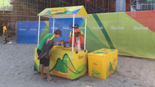 A happy punter finally gets a beer after Rio’s unnecessarily complex way to buy food and drink at the venues.