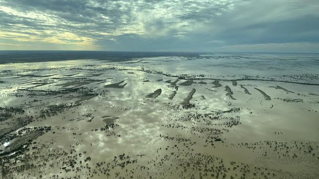 Dramatic skies and reflections over the floodwaters of the Warburton and Kallakoopah. Picture: Trevor Wright
