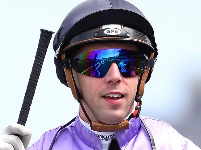 Jockey Brenton Avdulla on Tower of Song gestures to the crowd as they return to scale after winning the Bowermans Office Furniture Handicap race during the Moet & Chandon Spring Champion Stakes Day at Randwick Racecourse in Sydney, Saturday, Oct. 8, 2016. (AAP Image/David Moir) NO ARCHIVING, EDITORIAL USE ONLY