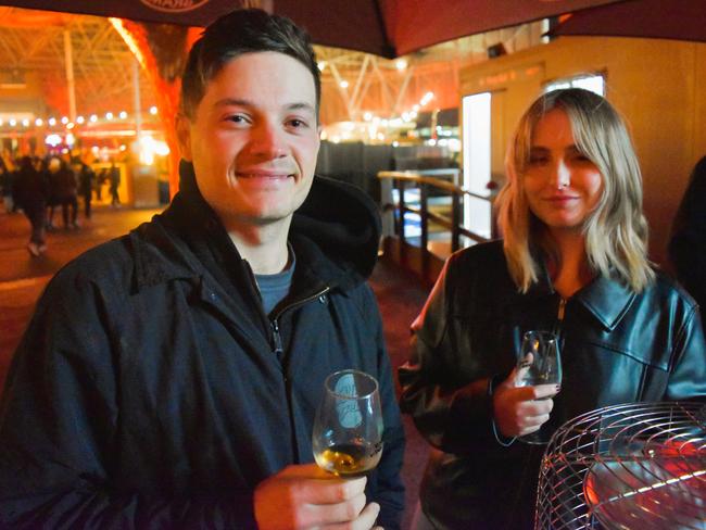 Jordan Masters and Emma Ciccone at the Whisky, Wine and Fire Festival 2024 at the Caulfield Racecourse. Picture: Jack Colantuono