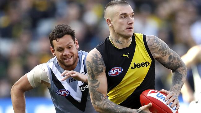 Port Adelaide’s Steven Motlop, left, chasing Richmond’s Dustin Martin last weekend, is one of two Power players to be dropped. Picture: Dylan Burns/AFL Photos