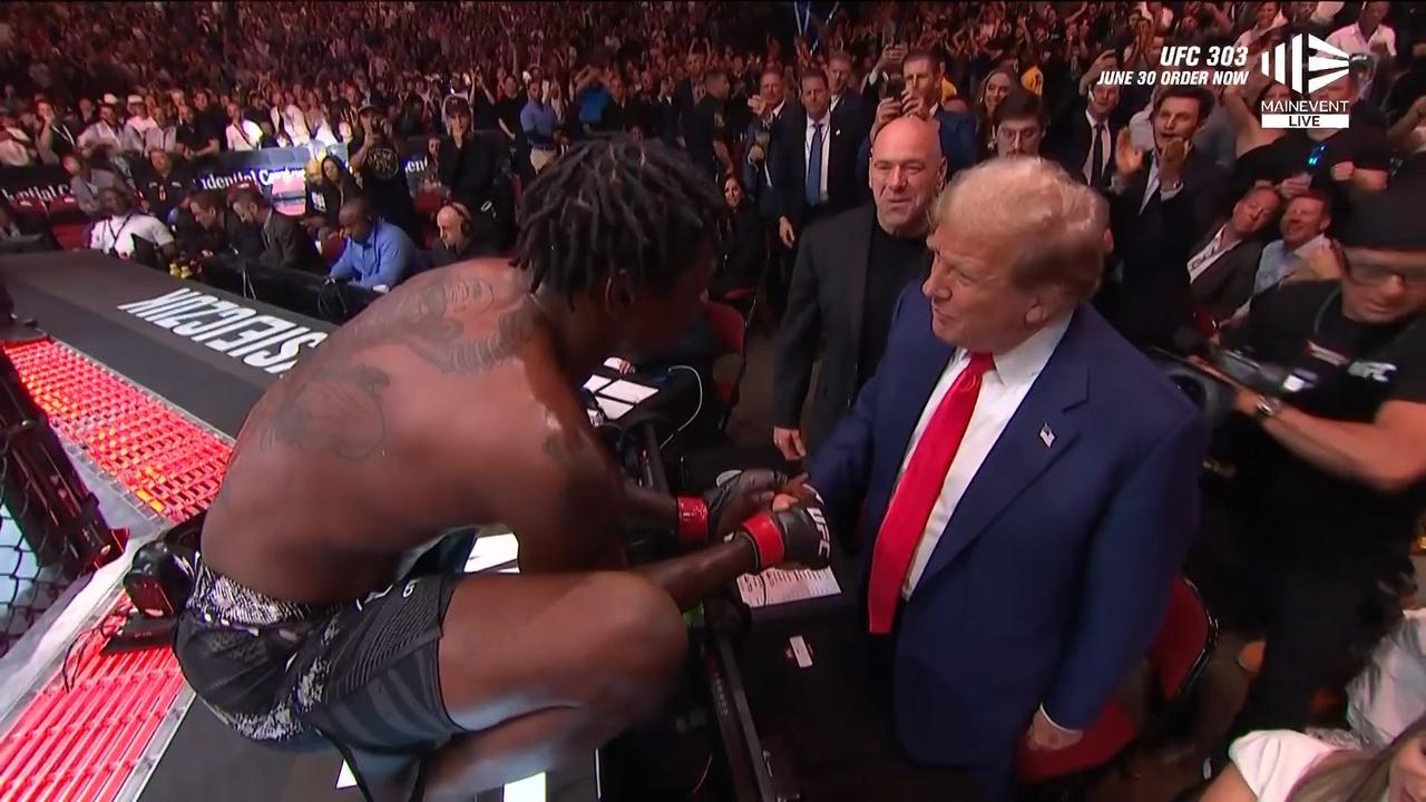 Kevin Holland greets the former president after his win.