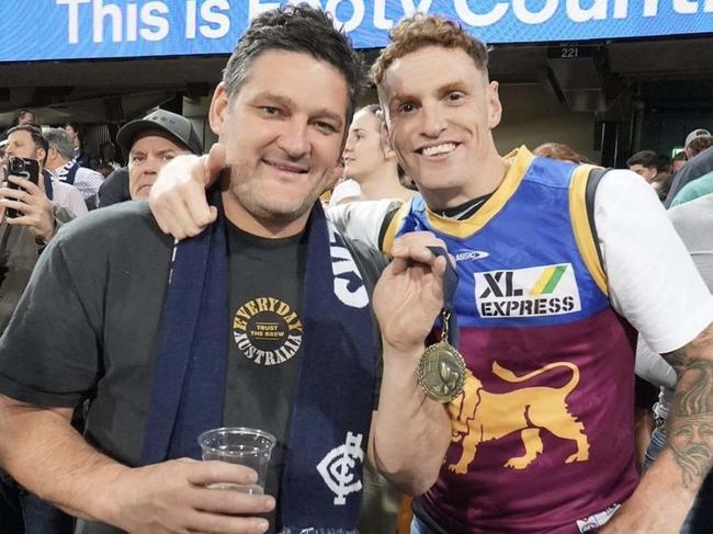 Brendan Fevola with Mitch Robinson at the Gabba on Saturday night.