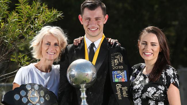 Mother Fiona-Gaye Moore, daughter Ceili and son Jonty with the world Irish dancing championship trophies. Picture: Robert Pozo