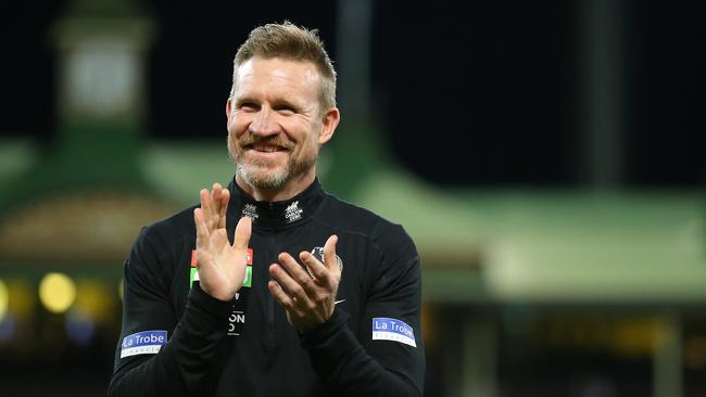 Buckley applauds his players after they pulled off an upset win in his final game at the helm. Picture: Getty Images