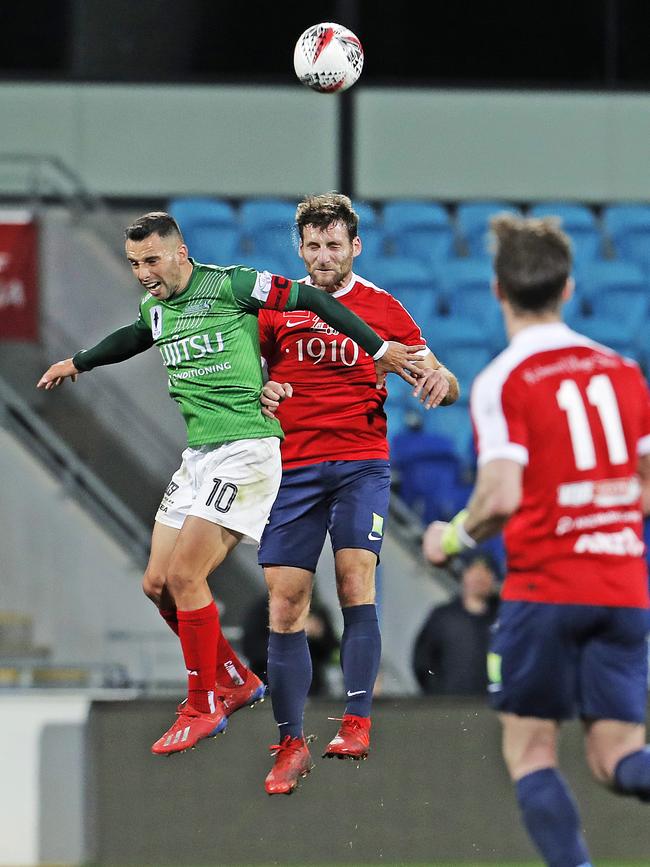 Marconi’s Marko Jesic and South Hobart's Loic Feral compete for the ball. Picture: ZAK SIMMONDS