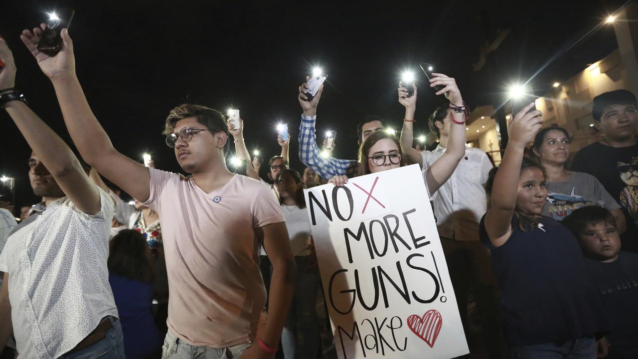 People gather in Juarez, Mexico, in a vigil for the 3 Mexican nationals who were killed in an El Paso shopping-complex shooting. Picture: AP