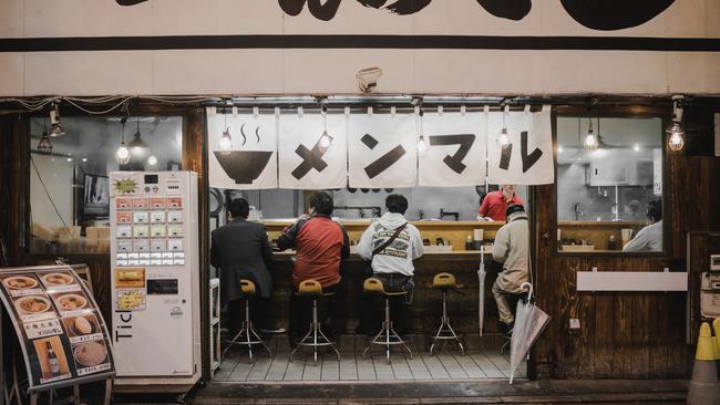 People dining on bowls of ramen at a local ramen shop. Picture: Unsplash.com/reddf