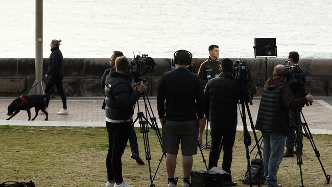 Hawks star Jaeger O'Meara holds a presser at Coogee Beach.