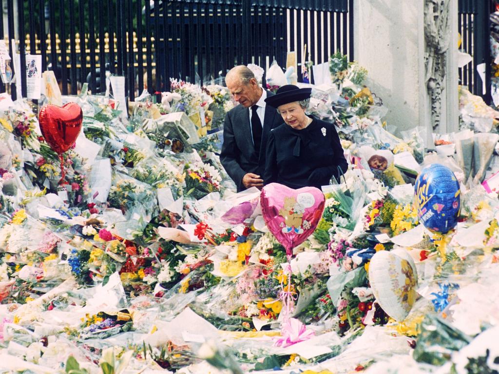 Prince Philip and Queen Elizabeth II at the floral tributes left outside Buckingham Palace for Diana in 1997. Picture: Shutterstock