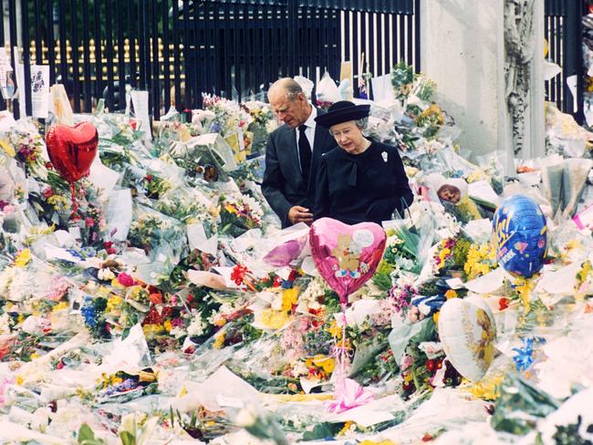 Prince Philip and Queen Elizabeth II at the floral tributes left outside Buckingham Palace for Diana in 1997. Picture: Shutterstock