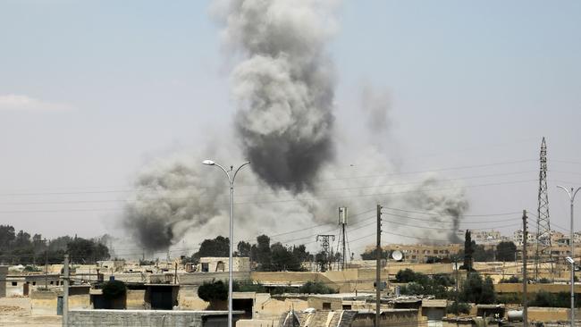 Smoke rises over Raqqa as US-backed forces move in. Picture: AFP