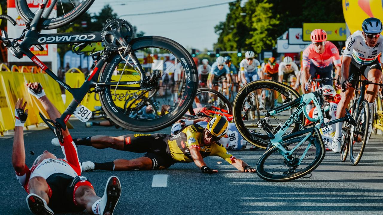 Dutch cyclist Dylan Groenewegen (on the ground ,C) and fellow riders collide during the opening stage of the Tour of Poland race in Katowice.