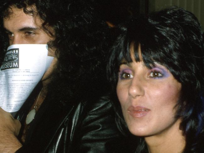 DECEMBER 1979: Entertainers and celebrity couple Gene Simmons and Cher attend the premiere of the movie "Kramer vs. Kramer" in December 1979. (Photo by Michael Ochs Archives/Getty Images)