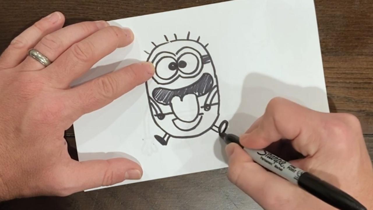 Step 20: draw the second minion’s legs out to the side like he is jumping.