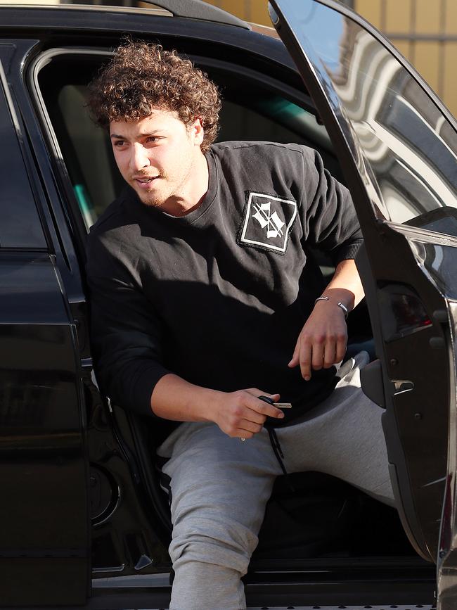 Daniel Ibrahim, freshly out on bail, arrives at a Dover Heights home on Saturday.