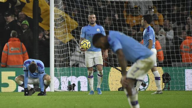 Manchester City' players react after Wolverhampton Wanderers' Matt Doherty scored his side's third goal. Picture: AP