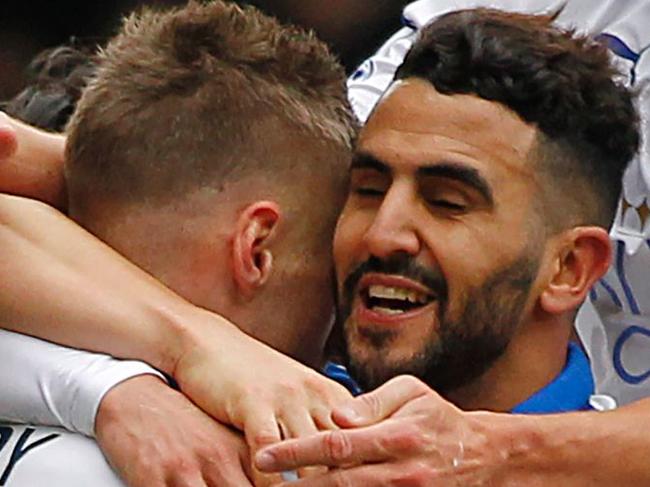 Leicester City's Riyad Mahrez (3rd R) celebrates after scoring his team's first goal during the English Premier League football match between Crystal Palace and Leicester City at Selhurst Park in south London on March 19, 2016. / AFP PHOTO / IKIMAGES / IKimages / RESTRICTED TO EDITORIAL USE. No use with unauthorized audio, video, data, fixture lists, club/league logos or 'live' services. Online in-match use limited to 45 images, no video emulation. No use in betting, games or single club/league/player publications. /