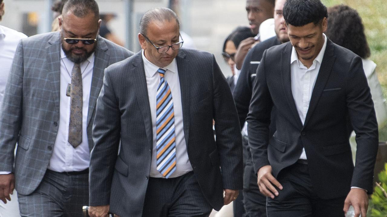 St George Illawarra Dragons player Junior Amone (far right) and his father (light suit, left) walking into court together on Monday morning. Picture: NCA NewsWire / Simon Bullard.