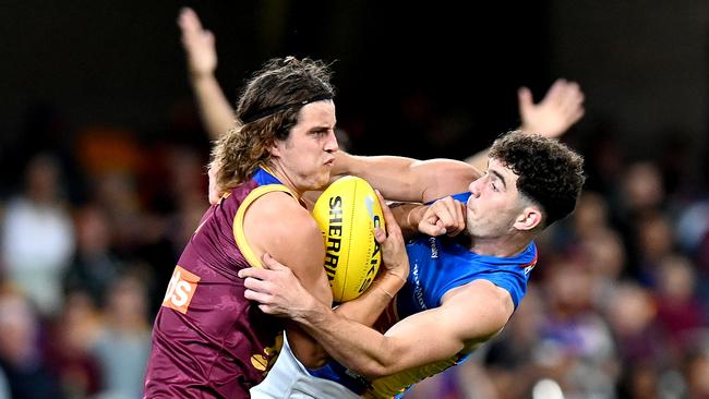 The Lions’ Jarrod Berry attempts to break away from the Gold Coast defence. Picture:by Bradley Kanaris/Getty Images)\