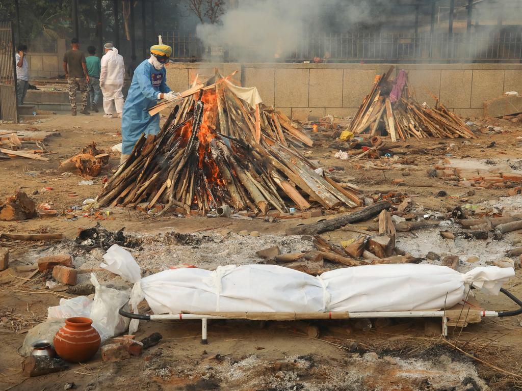 The body of a COVID-19 victim is seen before cremation at one of India’s overwhelmed crematoriums. Picture: Naveen Sharma/Getty Images