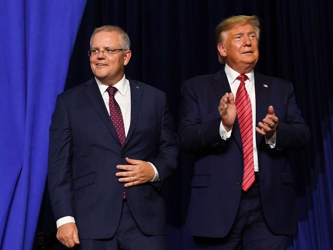 (FILES) In this file photo taken on September 22, 2019 US President Donald Trump and Australian Prime Minister Scott Morrison arrive to speak during a visit to Pratt Industries plant opening in Wapakoneta, Ohio. - Donald Trump asked Australia to "assist" in discrediting a Russia investigation that has clouded his presidency, with Prime Minister Scott Morrison admitting on October 1, 2019 that he agreed to help. (Photo by SAUL LOEB / AFP)