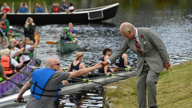 Britain's King Charles III reacts as he meets boaters on the by the River Erne, during a visit to Enniskillen Castle. Picture: AFP