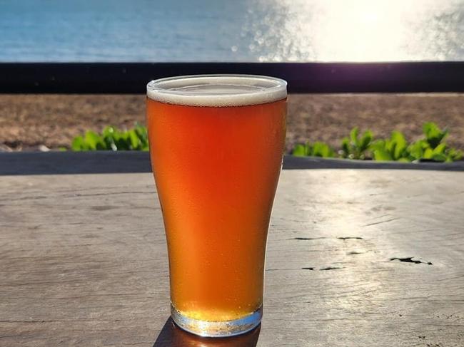 Darwin Brewing Co beer overlooking the ocean. Picture: Kate Dinning