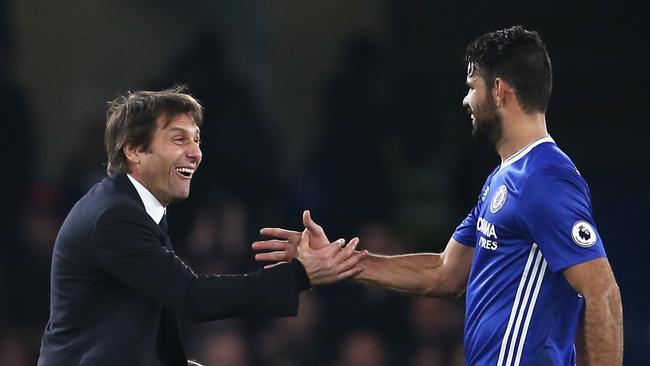Antonio Conte (L), Manager of Chelsea congratulates Diego Costa (R).