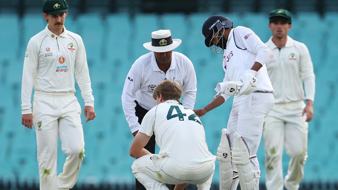 Cameron Green of Australia A reacts after being hit in the head.