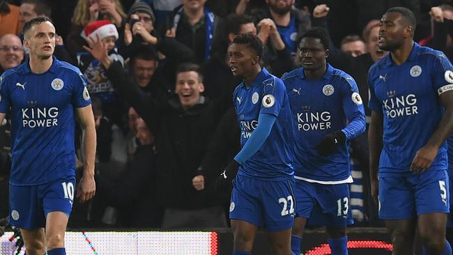 Leicester City's Ghanaian midfielder Daniel Amartey (C) celebrates.