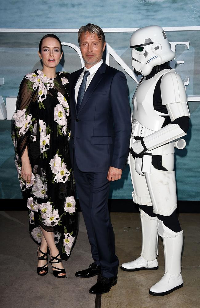 Mikkelsen and Mrs Erso, aka Northern Irish actor Valene Kane, rudely interrupted by a Stormtrooper at the London premiere of Rogue One on December 13. Picture: Stuart C. Wilson / Getty