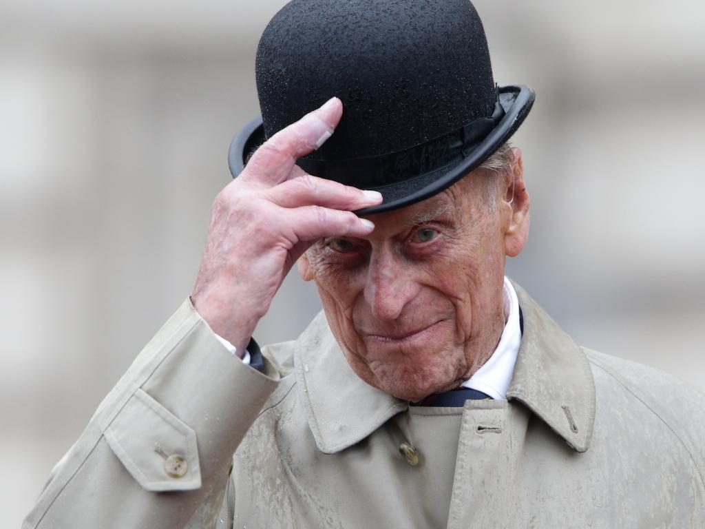 LONDON, ENGLAND - AUGUST 2:  Prince Philip, Duke of Edinburgh raises his hat in his role as Captain General, Royal Marines, as his final individual public engagement as he attends a parade to mark the finale of the 1664 Global Challenge, on the Buckingham Palace Forecourt on August 2, 2017 in London, England. (Photo by Yui Mok - WPA Pool/Getty Images)