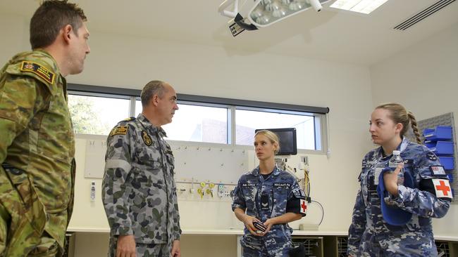 Australian Defence Force health professionals plan for the day ahead at the North West Regional Hospital in Tasmania, after a virus outbreak at the hospital.