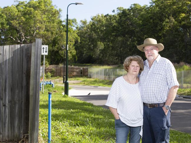 Stan and Suz Corbett have been campaigning against the Inland Rail for many years. Thursday, March 19, 2020. Stan and Suz pose for a photograph next to the Hillcrest/Forestdale corridor where homes are still being built. (AAP Image/Renae Droop)