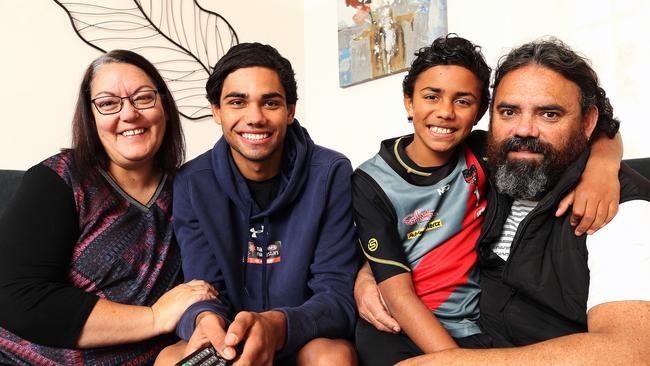 Tarryn Thomas (second from left) relaxes with his family. PICTURE CHRIS KIDD