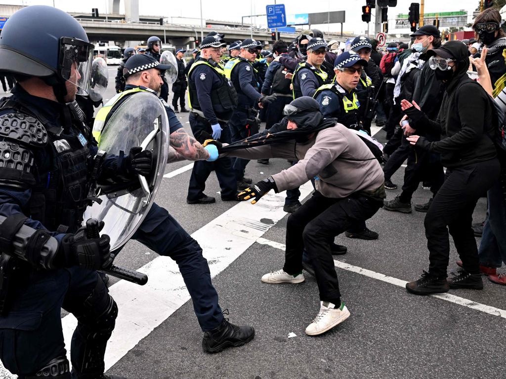 Protesters confront police outside the Land Forces 2024 arms fair in Melbourne on September 11, 2024. (Photo by William WEST / AFP)