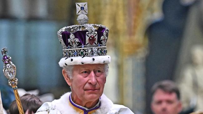 LONDON, ENGLAND - MAY 06: Britain's King Charles III wearing the Imperial state Crown carrying the Sovereign's Orb and Sceptre leaves Westminster Abbey after the Coronation Ceremonies on May 6, 2023 in London, England. The Coronation of Charles III and his wife, Camilla, as King and Queen of the United Kingdom of Great Britain and Northern Ireland, and the other Commonwealth realms takes place at Westminster Abbey today. Charles acceded to the throne on 8 September 2022, upon the death of his mother, Elizabeth II. (Photo by Ben Stansall  - WPA Pool/Getty Images)