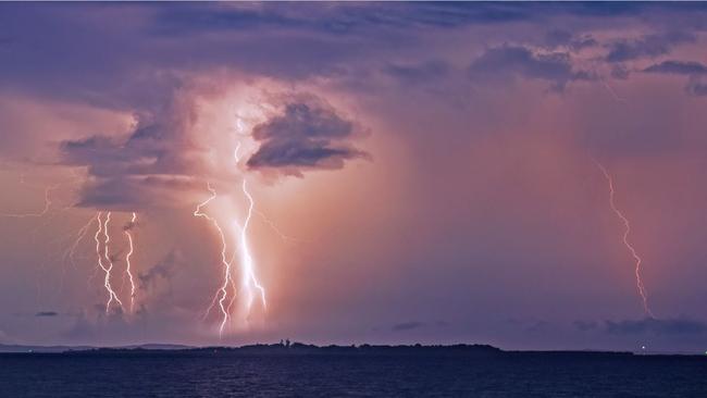 Insane lightning show over Moreton Bay as seen from the Wynnum Jetty on Wednesday evening. Picture: Doug O'Neill