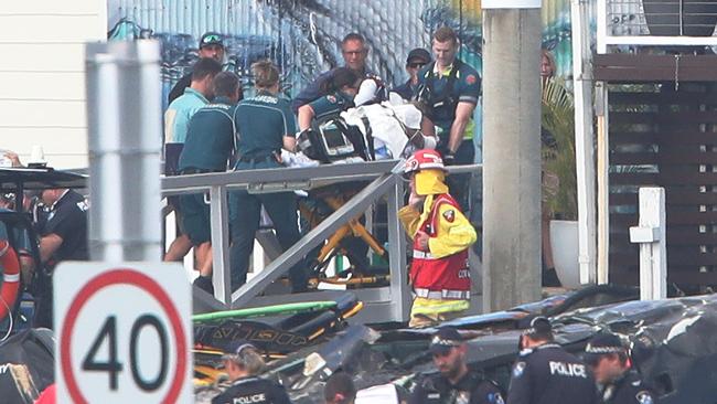 The injured are taken to hospital from the tourist park on the Southport Broadwater. Picture Glenn Hampson