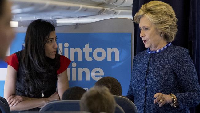 Clinton with long-time close aide Huma Abedin. Picture: AP
