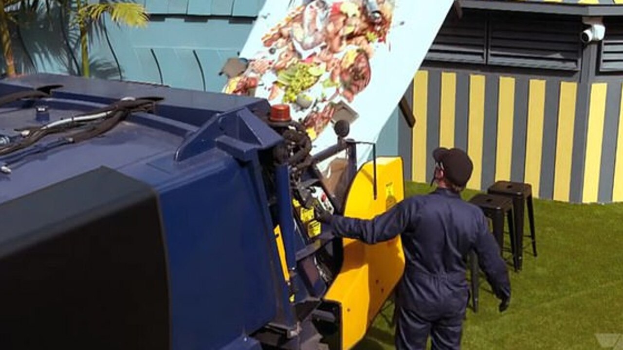 The scene depicted a table full of breakfast food tipped into a garbage truck.